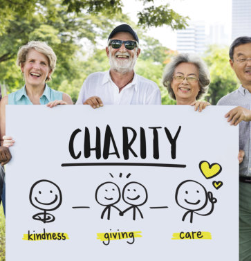 elderly people holding charity signage