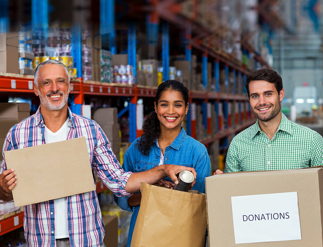 people holding boxes of donations