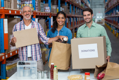 three volunteers smiling