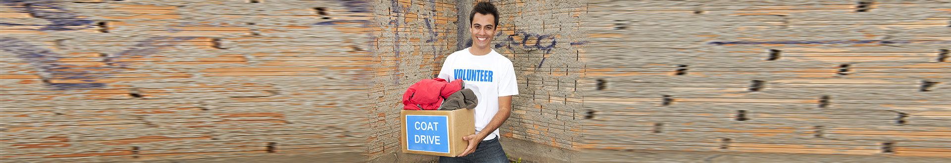 volunteer man carrying a box