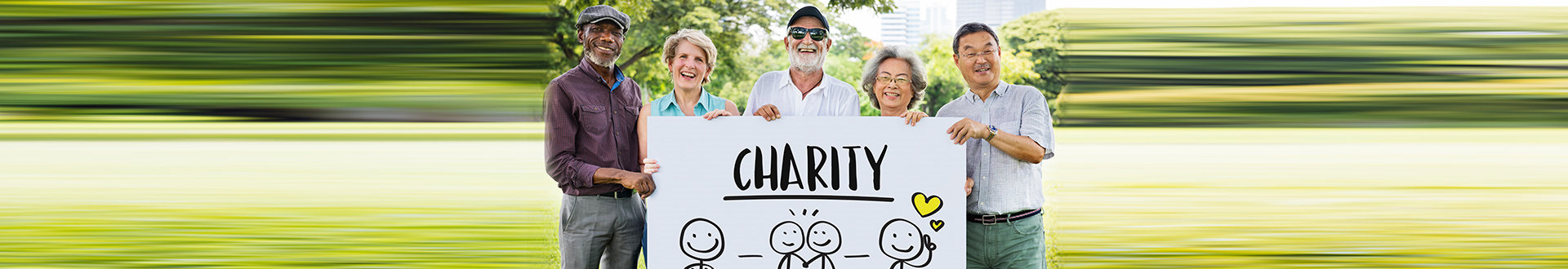 seniors smiling with their charity banner